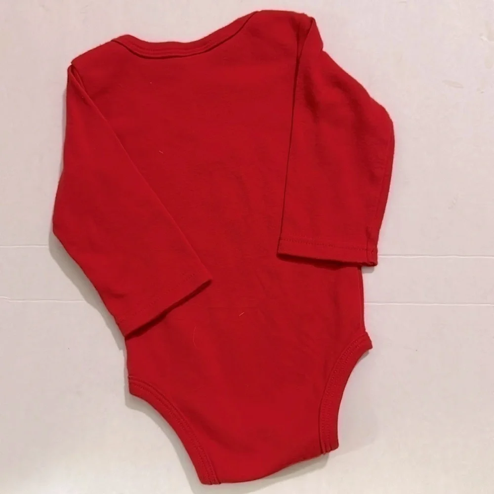 Santa’s little helper with reindeer pants 3 months